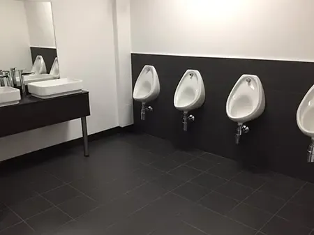 Two sinks and three urinals